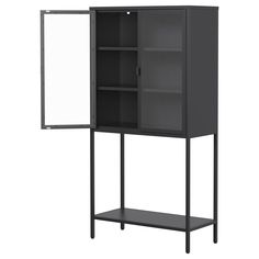 a black cabinet with two doors and one shelf on the bottom is open to reveal a white board