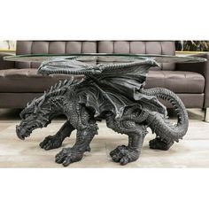 a dragon coffee table sitting on top of a wooden floor