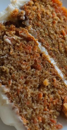 a slice of carrot cake on a white plate