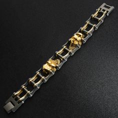 Description: Stainless steel black and 18K gold plated skull bracelet. Approx. Weight: 72 grams Available Sizes: 7", 8", 9", 10' Approx. Dimensions(mm): 20mm x 177.8mm(Length varies by SKU) Approx. Dimensions(Inches): 0.79" x 7"(Length varies by SKU) Bike Chain Bracelet, Steel Bike, Bike Chain, Jewelry Website, Skull Bracelet, Stylish Bracelet, Skull Design, Italian Charm Bracelet, Wholesale Jewelry