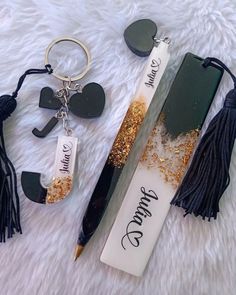 a pen, keychain, and other items are laying on a white furnishing