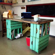 a desk made out of pallet wood in a classroom