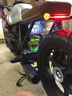 a close up of a motorcycle with a license plate on it's back tire