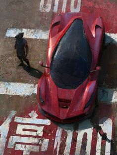 an aerial view of a red sports car