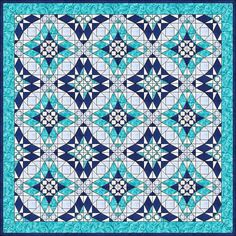 a blue and white quilt with an intricate design