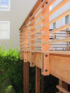 the wooden railings are attached to the house