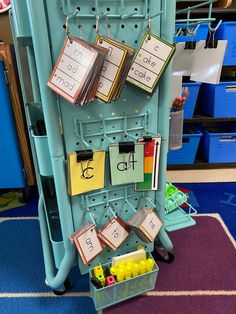 a blue rack with cards and bins filled with lemons next to other items