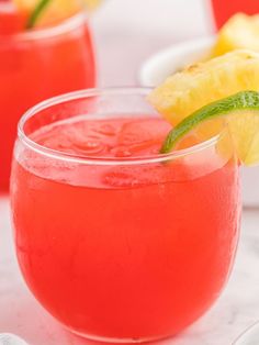 two glasses filled with watermelon and pineapple punch