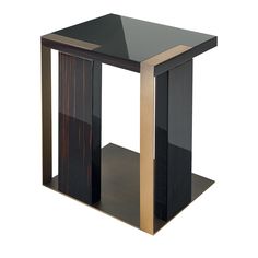 a black and gold side table with one shelf