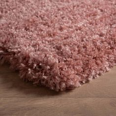 a pink area rug on the floor