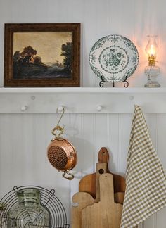 kitchen utensils and other items are displayed on shelves