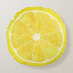 a lemon slice cut in half on a white surface