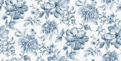 a blue and white floral wallpaper with large flowers on the left side of it