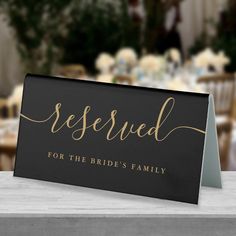 a sign that says reserved for the bride's family on top of a table