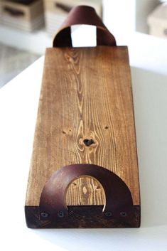 a wooden bag sitting on top of a white table