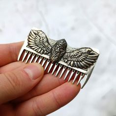 Powerful silver odin comb for your royal hairstyle Every decent man should have a high-quality comb to any time be ready for a raid. You may call it old fashion, but a stylish comb is irreplaceable tool in every man’s armory. Make your hairstyle look neat and gorgeous with the help of unique handmade comb from Viking Collection.This is custom comb made from Silver solid (925 Ag) by the hands of professional master. High-quality and favorable price give this comb a competitive advantage comparing Royal Hairstyle, Royal Hairstyles, Pagan Gifts, Huginn And Muninn, God Of Wisdom, Handmade Comb, Viking Beard, Norse Pagan, Beard Combs