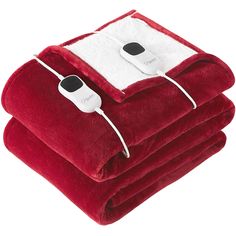 two electric heated blankets stacked on top of each other, with one blanket folded down