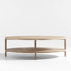 an oval coffee table with two shelves on each side