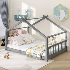 a child's bed with a metal frame and canopy over it, in a white room