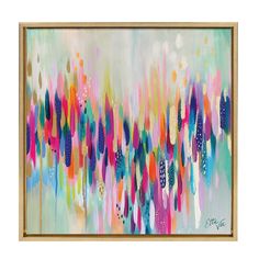 an abstract painting with multicolored paint and gold frame on a white wall above it