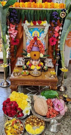 there are many bowls and plates on the table with food in them, including flowers