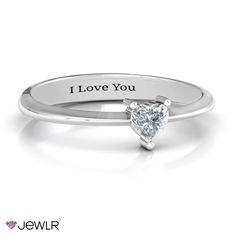 a heart shaped diamond ring with the words i love you on it's side