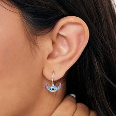 For Lilo & Stitch fans, these hoop charm earrings are an absolute delight. These Stitch earrings feature the mischievous Experiment 626 himself dangling from a hoop. This fun Disney jewelry makes for a great Christmas gift, Valentine’s Day gift, and birthday gift. .925 sterling silver Officially licensed Disney Jewelry Includes complimentary Stitch gift box and pouch Experiment 626, Stitch Stuff, Stitch Earrings, Stitch Jewelry, Stitch Gift, Hoop Charms, Lilo Stitch, Gift Valentine, Birthstone Earrings