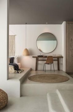 a bathroom with a sink, mirror and bathtub next to a staircase leading up to a bedroom