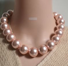 Material: shell pearl Making Technics: Full Handmade shell pearl size:20mm huge 20 mm pink sea shell pearl necklace ,statement necklace,women necklace ,pink Beaded Necklaces for Women,wedding necklace String: ready made color: pink length:choose if you need other length/ size / color, all could contact me please! Pink Pearl Necklace For Wedding, Pink Pendant Pearl Necklace For Wedding, Cheap Handmade Pink Pearl Necklace, Pink Pearl Drop Necklace, Vintage Pink Pearl Necklace, Heart-shaped Pink Pearl Necklace, Necklace String, Hand Beaded Bag, Jade Bead Necklace