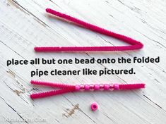 two pink toothbrushes with the words, space all but one bed onto the folded pipe cleaner like picture