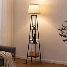 a floor lamp in the corner of a living room