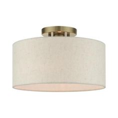 a light fixture with a white shade on it