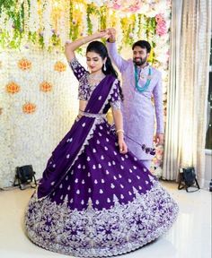 Regal Ways To Add The Jewel-Tone Purple To Your Wedding - ShaadiWish Bridal Lehenga Reception Look, Violet Half Saree Pattu, Reception Couple Dress Indian Latest, Lehanga Reception Look, Bride Lehangas For Reception, Half Sarees For Reception, Lehanga For Reception Bridal Couple, Bridal Lehengas For Reception, Half Saree For Reception