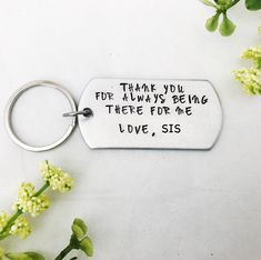 a keychain that says thank you for always being there for me i love, sis