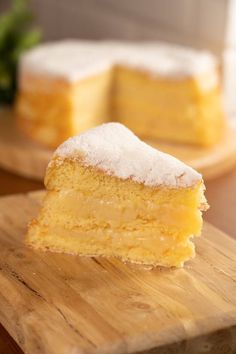 a piece of cake sitting on top of a wooden cutting board