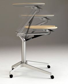 an office chair with four different tables on it's back legs and one sitting in front of the desk