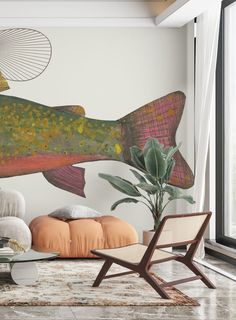 a living room with a fish mural on the wall