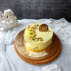 a cake sitting on top of a wooden plate