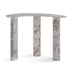 an oval marble table with two columns