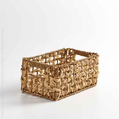 a woven basket on a white background