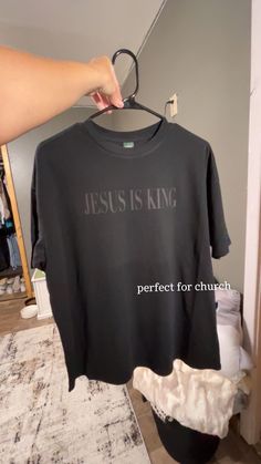 Black Tshirt that says Jesus Is King. Runs big. Hey everyone, I have a small business where I make and sell custom/personalized tees and tanks. Mostly, everything runs true to size. Feel free to direct message me for more information. Custom Text Black Cotton T-shirt, Black Cotton T-shirt With Custom Text, Catholic T Shirts, Christian Tshirt Design Ideas, Jesus Shirts Christian Clothing, Christian Tees Women, Jesus T Shirts, Jesus Is King Shirt, Christian Clothes