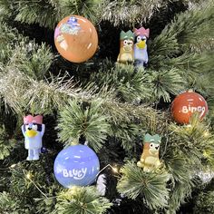 some ornaments are hanging on a christmas tree