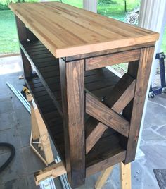 a table made out of wooden planks in a garage