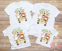 two t - shirts with the words mommy and me on them, sitting in front of a wooden background