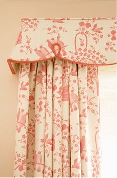 the curtains are hanging on the window sill in front of the window with pink flowers and birds