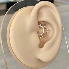 a pair of ear piercings sitting on top of a table