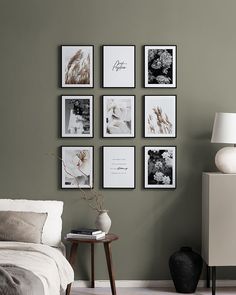 a bedroom with green walls and pictures on the wall, including a white bed in between two nightstands