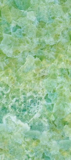 an abstract green and yellow background with lots of small bubbles in the water on top of it