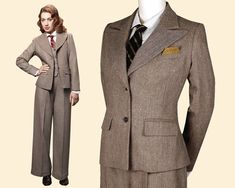 "Your search for the perfect vintage ladies suit has finally come to an end. Wide peaked lapels and slightly emphasized shoulders provide for sharp masculine accents that complete excellently the womanly curves of this jacket. It is masterfully fitted with superbly placed darts and hugs your female curves like a dream! Delicate details like the two welt pockets with pocket flaps and a chest pocket provide room for a pocket square to refine the look even further. Paired with the matching high-wai 1920s Office Fashion, Women Vintage Suits, 1920s Business Woman, 1920s Womens Suit, Dark Academia 30s, Women In Suits Vintage, Vintage Tweed Jacket With Lapel Collar For Office, Vintage Notch Lapel Tweed Jacket For Office, Vintage Tweed Jacket With Notch Lapel For Office