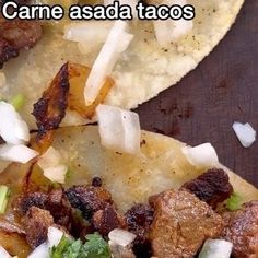 two tacos with meat, onions and broccoli